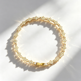 Cross-shaped diamond-encrusted tennis bracelet