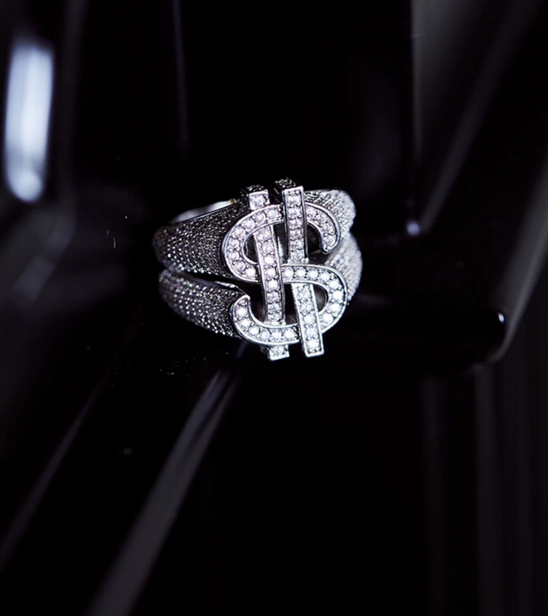 Ring with dollar sign and diamond studs