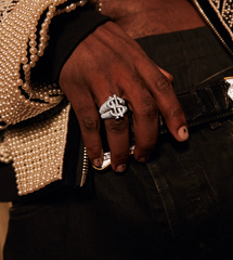 Ring with dollar sign and diamond studs