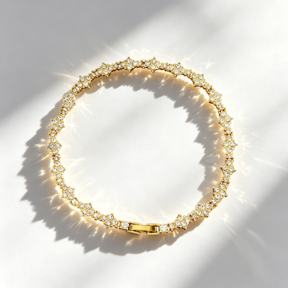 Cross-shaped diamond-encrusted tennis bracelet